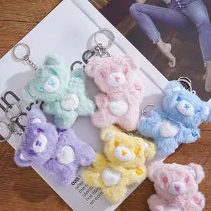 Cute plush bear keychain with heart detail, soft cartoon bag accessory for gifts.