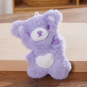 Cute purple plush bear pendant with white heart, soft stuffed keychain for bags and keys.