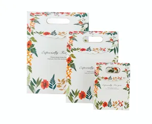 Bloemen cadeau papieren tassen set met handvatten, elegant botanisch ontwerp voor feest.