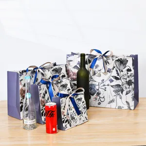 Sacchetti regalo in carta floreale all'ingrosso con manici in nastro, eleganti sacchetti.