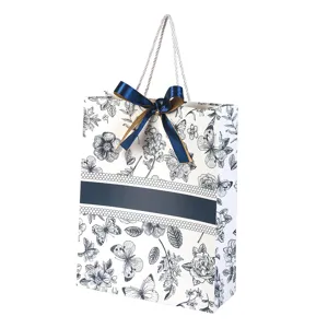 Saccadeau en carton blanc avec lamination de fleurs vintage, nœud élégant et poignées en corde.