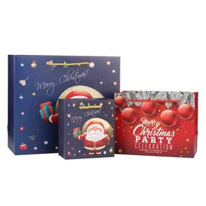 Christmas gift bags paper tote bags set with festive Santa and bauble prints for holiday packaging.