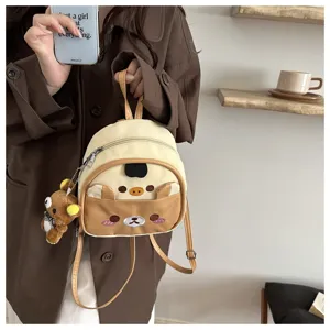 Detailed view of the cute cartoon bear mini backpack with adorable plush keychain.