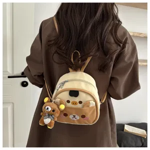 Detailed view of cute cartoon bear mini backpack with soft plush pendant and compact design.