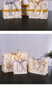 Detailweergave van papieren cadeautassen met bloemenprint en elegante strikken en handvaten.
