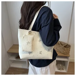 Stylish white tote bag with glitter butterfly prints and a cute matching pouch for commuting.