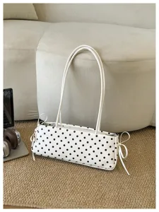 Borsa a tracolla a pois bianchi, elegante borsa baguette con fiocchi e manici sottili.