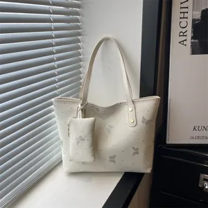 Trendy niche tote bag for women, summer new stylish commuting shoulder bag, chic design.