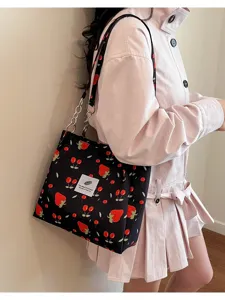Stylish black strawberry print tote bag with chain strap, perfect for daily casual use.
