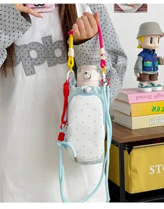 Detail view of the colorful polka dot crossbody water bottle bag with vibrant rope straps.