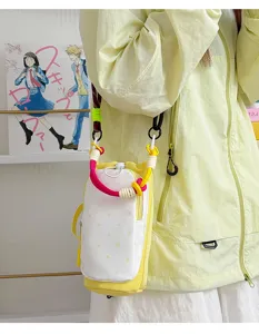 Detailed view of the colorful color-blocking crossbody phone and water bottle bag.