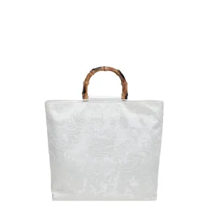 Élégant sac cabas en toile blanche avec poignée en bambou, grand design brodé à la main.