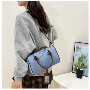 Denim Boston shoulder bag for women, retro casual commuter crossbody bag with brown leather trim.