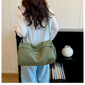 Small green plaid travel duffel bag for women, lightweight for short trips, casual gym bag.