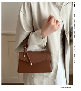 Stylish women's minimalist top-handle shoulder bag, premium brown leather small square bag.