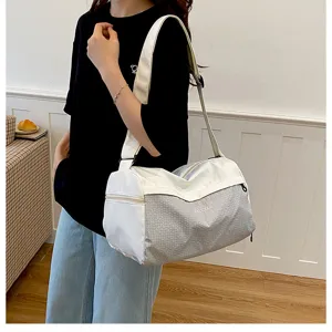 Small travel duffel bag for women, lightweight waterproof fitness gym bag and casual shoulder bag.