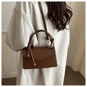 Women brown shoulder crossbody handbag, fashion leather small square bag with knot handle.
