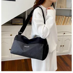 Black white grid travel duffel bag, lightweight portable casual fitness bag for short trips.