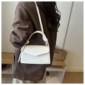 White PU leather top handle crossbody bag for women, stylish everyday shoulder bag. Chic design.