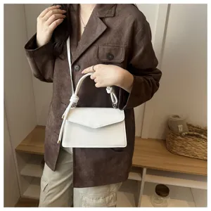 Stylish minimalist white shoulder bag with knotted handle for women daily casual fashion wear.