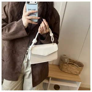 White PU leather shoulder handbag with knot handle, stylish daily detail view for women.