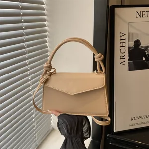 Minimalist chic PU leather handbag for women, versatile shoulder and cross-body design.