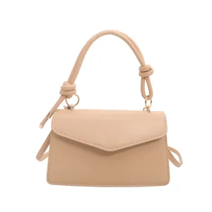 Chic minimalist apricot crossbody shoulder bag for women, stylish flap design with knotted handle.