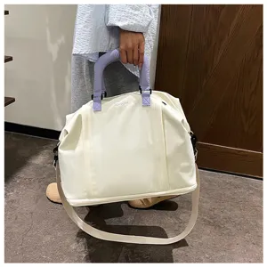 Large capacity canvas travel bag with purple handles, waterproof, lightweight and portable.