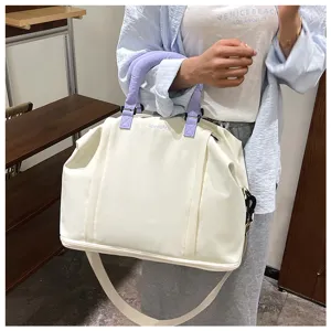Large capacity travel duffel bag waterproof lightweight hand luggage for women short trips.