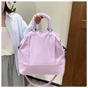 Large capacity travel duffel bag for women, waterproof weekend overnight flight luggage bag.