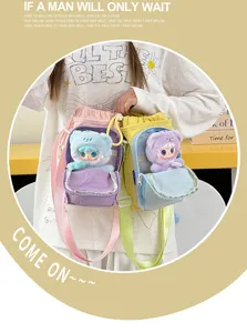 Stylish canvas crossbody water bottle bag with cute plush doll pendant, versatile and portable.