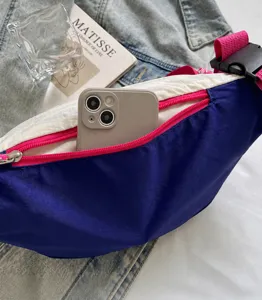 Close-up detail of dopamine color-blocking crossbody bag, showing zipper pocket and fashion design.