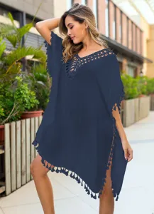 Close up view of navy blue crochet tassel beach cover up V-neck hollow out design details.