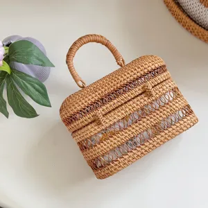 Handmade woven rattan handbag detail, retro structured wicker design with top handle.