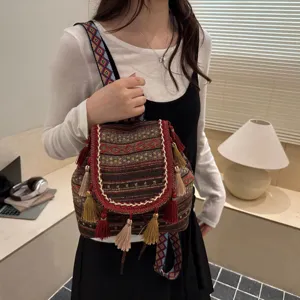 Retro ethnic style women small backpack with colorful woven pattern and chic tassel design for daily.