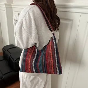 Ethnic style canvas shoulder bag, large capacity casual crossbody bag with colorful woven stripes.