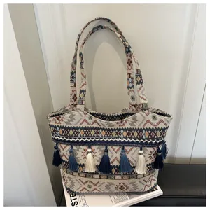 Retro ethnic style large canvas tote bag with tassels, perfect for daily commuting and fashion.