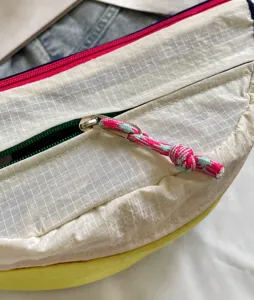 Lightweight color-block crossbody bag, waterproof outdoor travel shoulder bag for daily use.