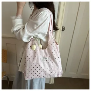 Korean style pink polka dot shoulder bag, large capacity casual tote bag for daily use.