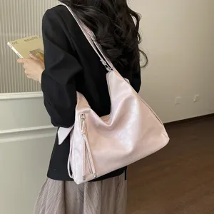 Borsa a tracolla morbida rosa alla moda per donna, grande borsa casual con nappine eleganti.