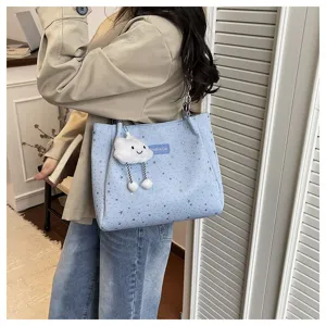 Casual star print tote bag with cute cloud pendant, stylish shoulder bag for daily commute.
