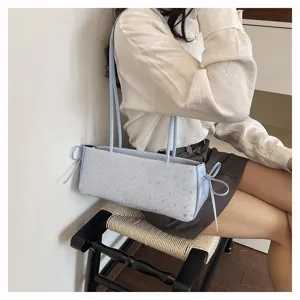 Light blue baguette shoulder bag for women, chic star print casual handbag with cute side bows.