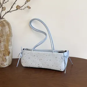 Light blue baguette shoulder bag for women with star print and side bow casual chic purse.