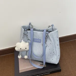 Light blue star print tote bag with purple straps, metal chains and cute cloud keychain.