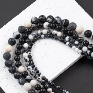 Detail view of natural zebra jasper stone round beads for DIY jewelry making crafting