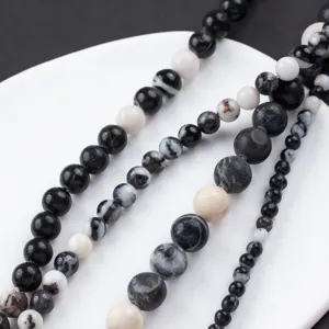 Black and white zebra jasper gemstone round beads DIY jewelry making supplies main view.