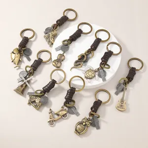 Detailed close-up view of vintage alloy leather keychains featuring diverse creative metal pendants.