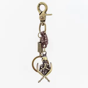 Llavero de calavera de bronce vintage con cuerda de cuero, anillo punk para hombre.