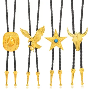 Vintage western bolo tie set with gold metal pendants including cowboy hat, eagle, star, bull skull.