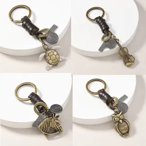 Vintage Cowhide Leather Alloy Pendant Keychain Creative Handmade Animal Instrument Key Ring For Car Backpack Ornaments Unisex